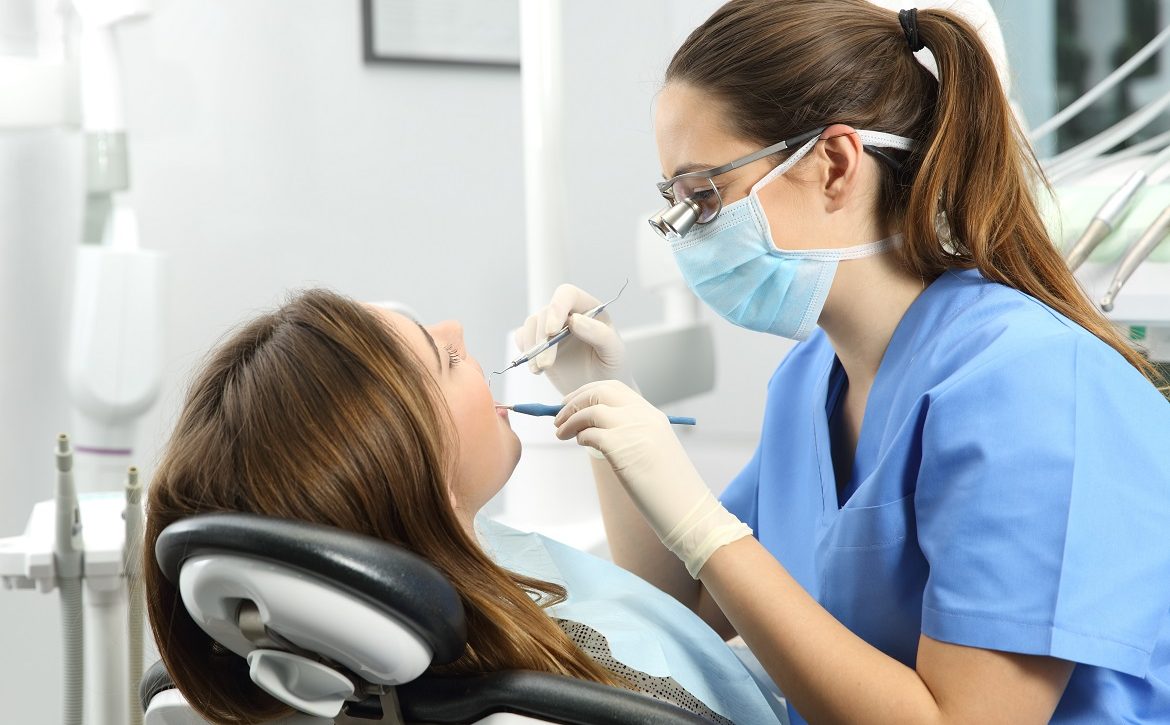 Dentist examining a patient teeth