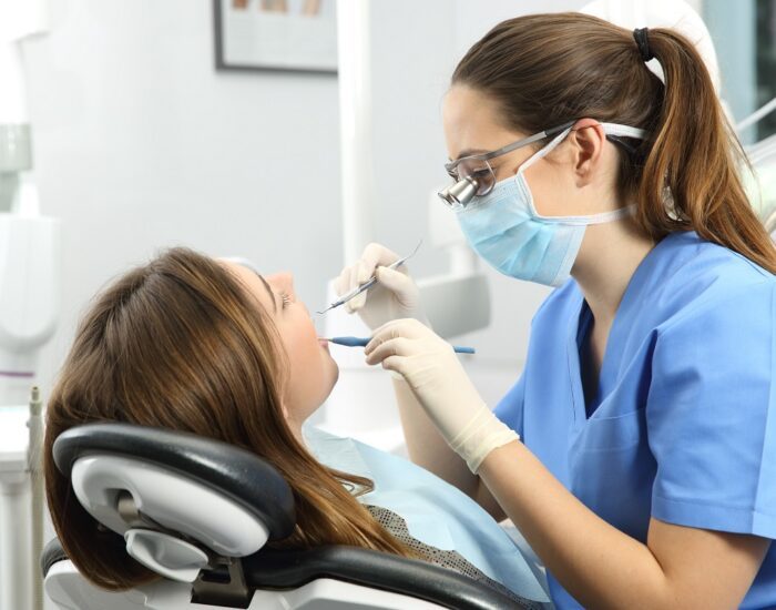 Dentist examining a patient teeth